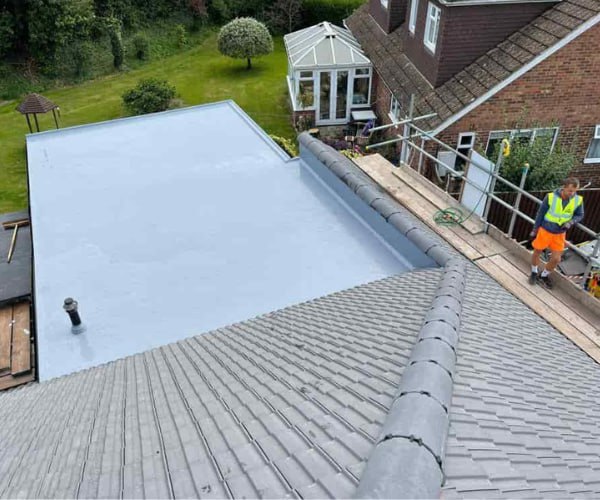 This is a photo of a newly installed hip roof, with a combined liquid covered flat roof. Work carried out by Maidstone Roofers